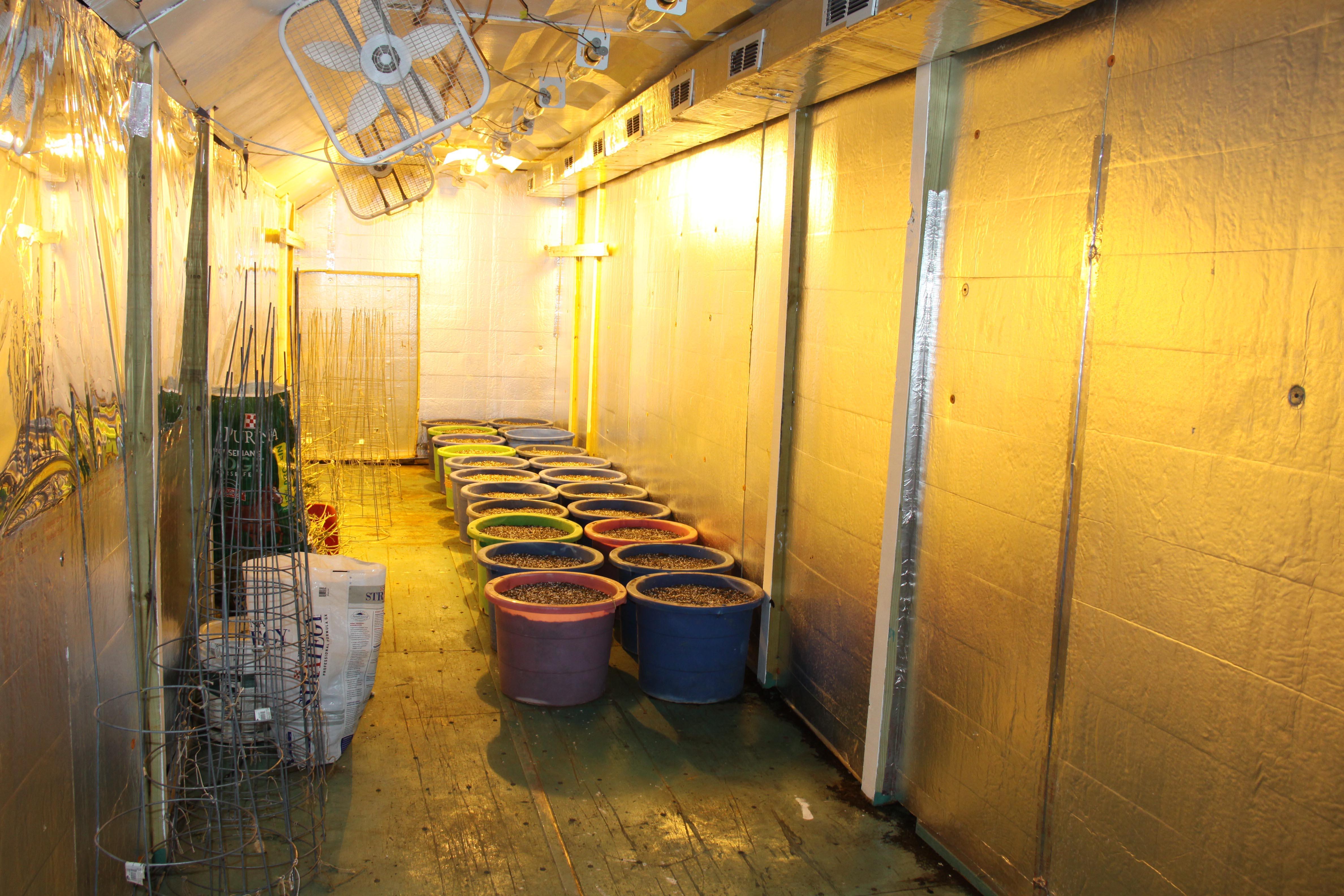 image portraying a storage with bins full of soil
