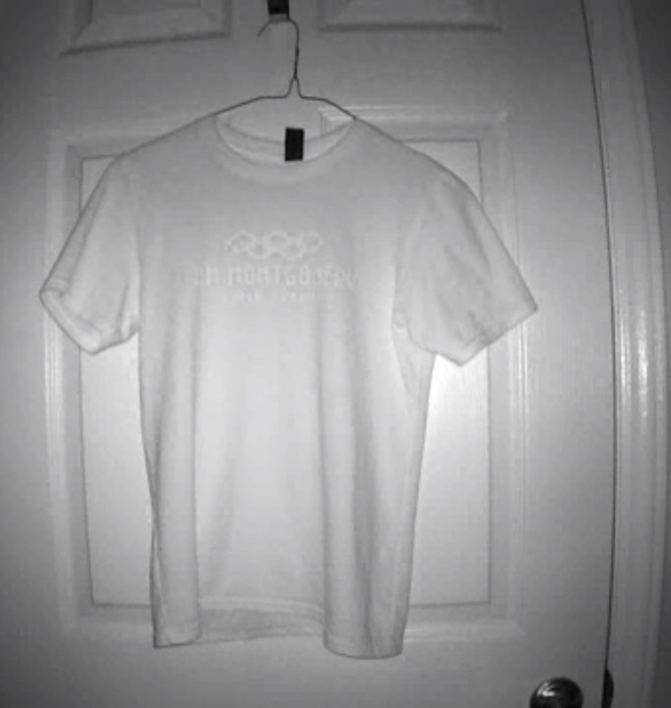 infrared image of a t-shirt hanging on a hook on a door