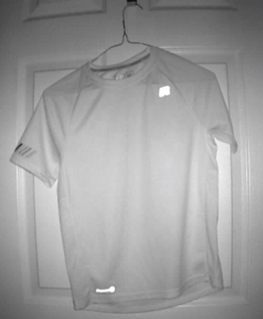 infrared image of a t-shirt hanging on a door