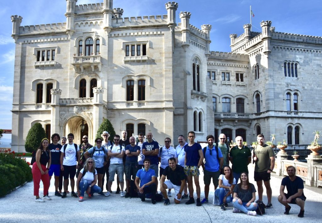 Amped team in front of castle of miramare in Trieste