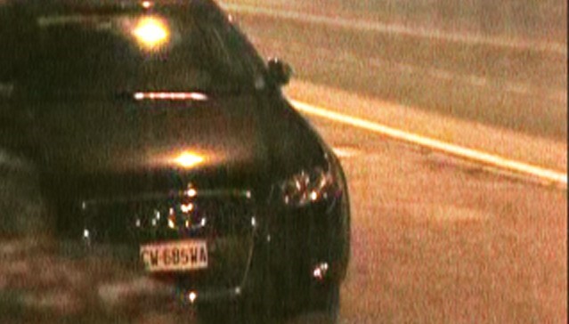 image of a black car with a clear license plate